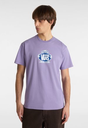 T-shirt in cotone viola con un logo Vans blu al centro, accompagnato da un personaggio dei cartoni animati. Design a maniche corte e collo rotondo.