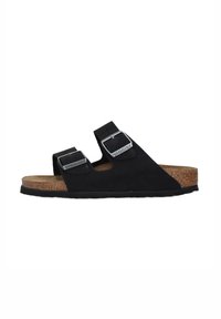 Sandali neri in suede con due fibbie argento regolabili, soletta in sughero e suola in gomma testurizzata, caratterizzati da un profilo piatto per il massimo comfort.