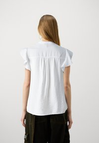 Vero Moda VMBEACH  - T-shirt imprimé - cloud dancer