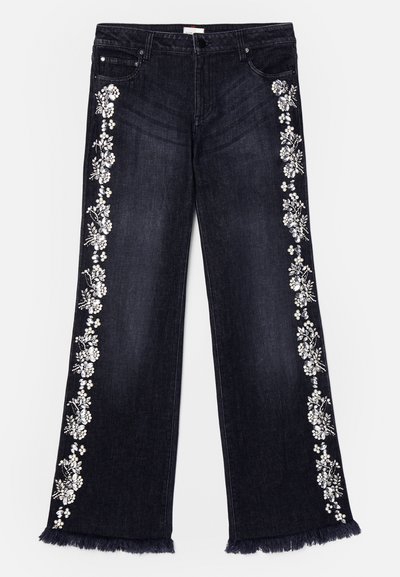Dark denim jeans with a wide leg design. Features floral embellishments along the sides and frayed hems. Five-pocket style.
