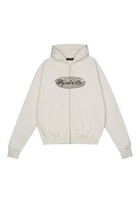 Zip-up hoodie in white cotton. Features a kangaroo pocket, ribbed cuffs, and a distressed black oval logo on the chest. Soft texture.
