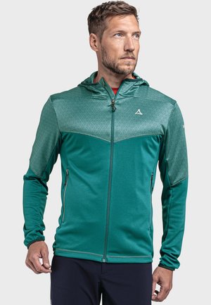 Grüne Sportjacke mit Reißverschluss vorne, Kapuze und strukturiertem geometrischem Muster im oberen Bereich. Verfügt über Reißverschlusstaschen und enganliegende Ärmel.