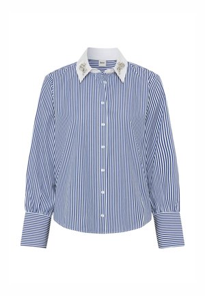 Blauw-witte gestreepte lange mouw shirt met een kraag. Bevat een versierde kraag en knopen aan de voorkant, met iets opgezette mouwen.