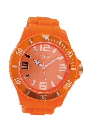 Bright orange watch with a silicone band, round plastic case, and an orange dial. Features large white hour markers and a date window.