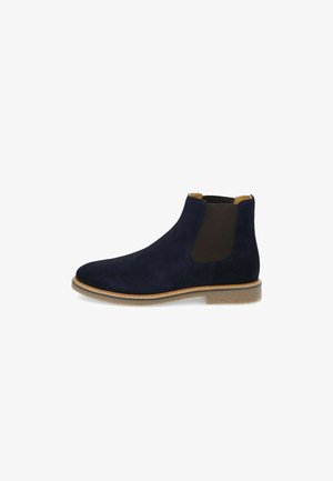 Navyblaue Wildleder-Ankle-Boots mit elastischen Seitenteilen, tanfarbenen Akzenten und einer strukturierten Sohle. Sie besitzen eine abgerundete Zehenpartie und minimale Nähdetails.