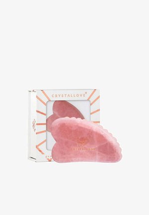 Rosa Rosenquarz Gua Sha Werkzeug mit gewellten Kanten, verpackt in einer weißen Box mit Pfirsichakzenten und dem Markennamen „CRYSTALLOVE“.