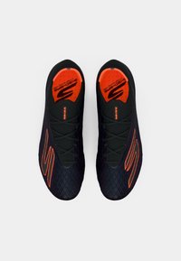 Black athletic shoes with a textured upper and orange accents. Features a lace-up design, cushioned insole, and rubber sole.