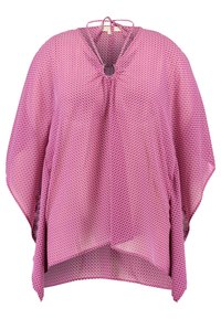 Keftan rose avec un motif géométrique, doté d'un col à nouer, de manches courtes et de fentes latérales pour faciliter l'habillage. Tissu léger et transparent.