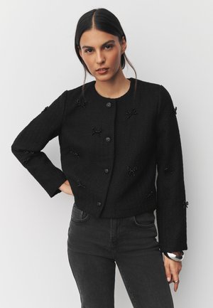 Next REGULAR FIT - BEADED BOW  - Lehká bunda - black