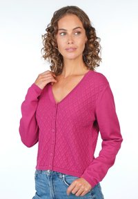 Fuchsia knit cardigan featuring a V-neck, textured diamond pattern, long sleeves, and front button closure.