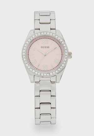 Zilverkleurige horloge met een roze wijzerplaat, Romeinse cijfers en een bezel met kristallen accenten. Metalen schakelarmband met een gladde, gepolijste textuur.