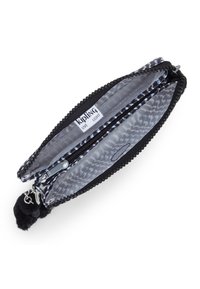 Black and gray patterned wallet with zipper closure. Interior features a contrasting geometric print and a pom-pom accent attached to the zipper pull.