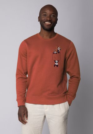 Roest-oranje sweatshirt van katoen, met een grafische zakafbeelding van cartoonpanda's en eetstokjes. Geribde manchetten en ronde hals.