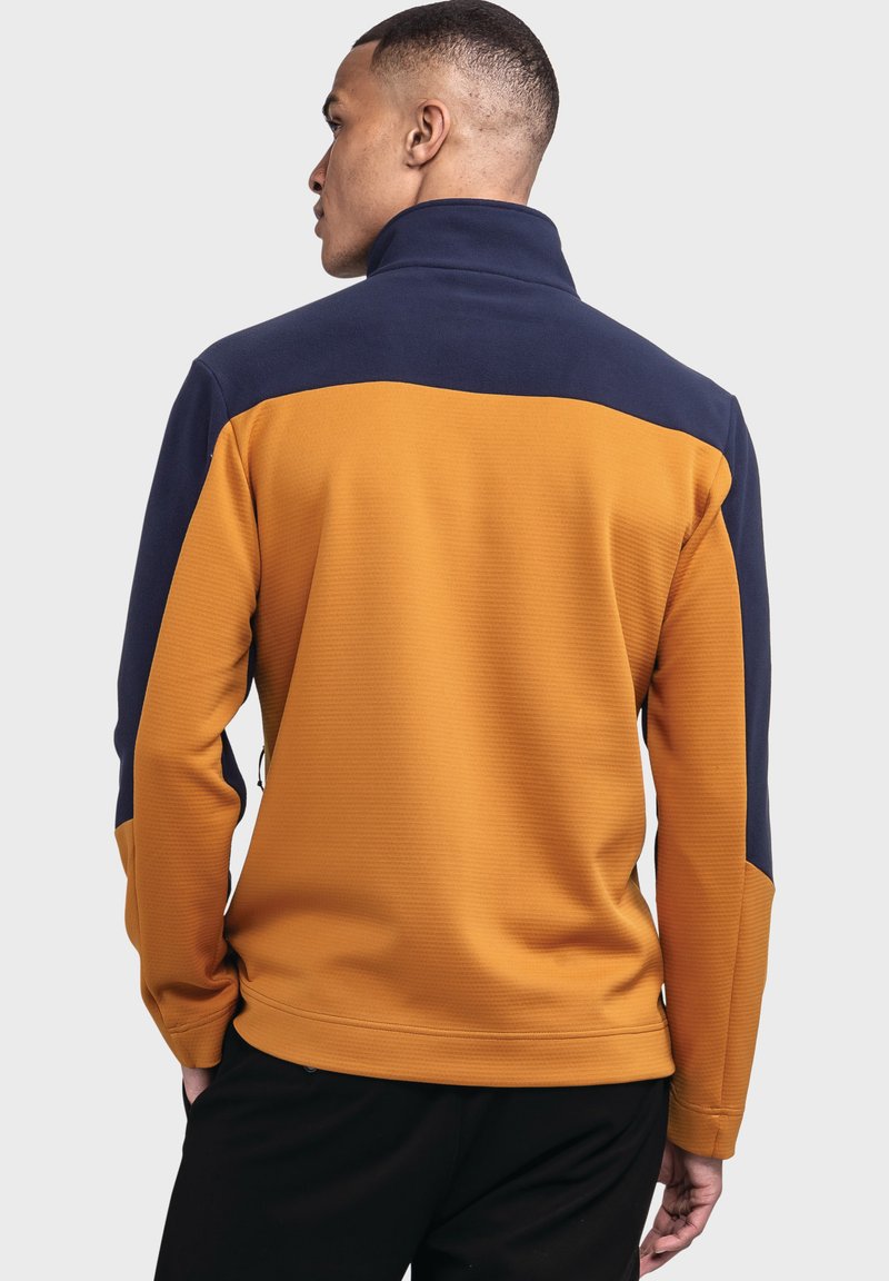 Fleece-Pullover mit einem strukturierten, orangefarbenen Körper und einem navyblauen oberen Abschnitt. Verfügt über einen hohen Kragen und Reißverschlusselemente.