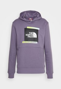 Sudadera morada de tela suave, con un gráfico cuadrado en blanco y negro que incluye el texto "THE NORTH FACE" y "NEVER STOP EXPLORING."