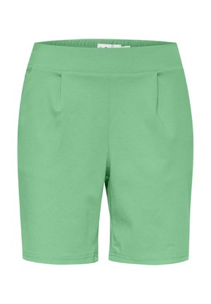 Green shorts made of soft fabric, featuring an elastic waistband, pleats on the front, and a straight cut. Smooth texture with no visible patterns.