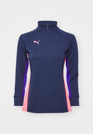 Navy long-sleeve performance top with a quarter-zip, featuring pink and purple side panels and a logo on the chest. Smooth texture.