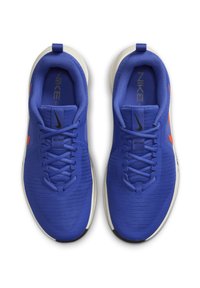 Blue athletic shoes with a mesh upper, black and orange accents, lace-up design, and a white rubber sole. Features "Nike" branding and "Just Do It" text.