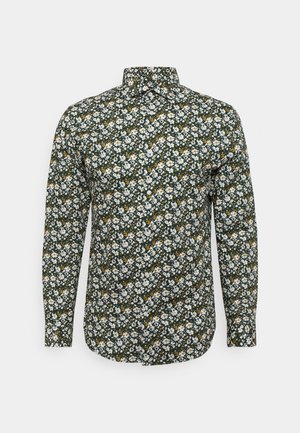 Langemouwig overhemd met een donkergroene basis, bedekt met een bloemenpatroon met witte en gele bloemen. Met knoopsluiting op de kraag.