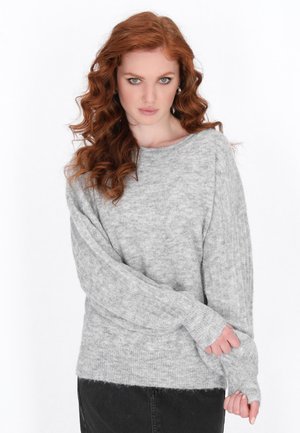 Gray knitted sweater with a soft texture, wide sleeves, and ribbed accents. The neckline is boat-shaped, enhancing the relaxed fit.