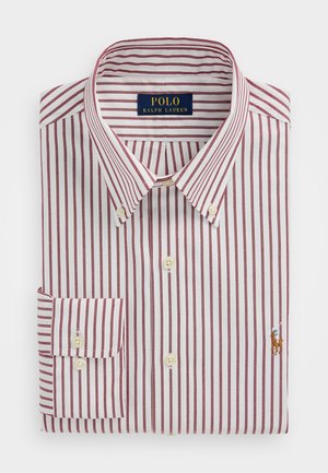 Piros és fehér csíkos ing, pamut anyagból, gombos gallérral, egyszálú mandzsetta gombbal, apró hímzett logóval a mellrészen.