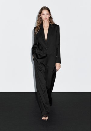 DARTED - Stoffhose - black