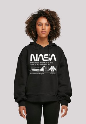 Black hoodie featuring a white NASA graphic, including text and shuttle design. Loose fit with adjustable drawstrings at the hood.