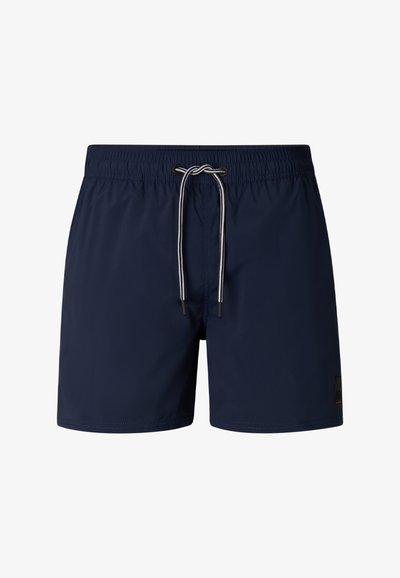 Marineblå badeshorts med elastisk talje og hvid snøre bundet i en sløjfe foran i midten.