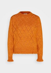 Pomarańczowy sweter robiony na drutach o teksturze w romby, okrągłym dekolcie oraz ściągaczach na mankietach i dole. Materiał wydaje się miękki i teksturalny.