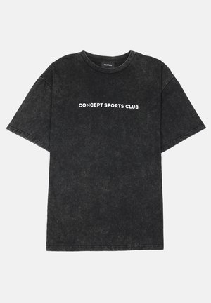 Black oversized t-shirt made of soft cotton, featuring a white "CONCEPT SPORTS CLUB" print on the front. Distressed texture. Short sleeves.