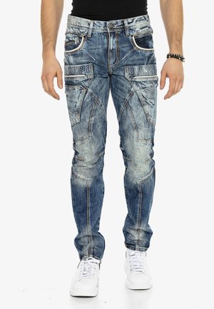 Blaue Denim-Jeans mit schmaler Passform, die über feine Stickerei, mehrere Taschen und ein ausgewaschenes Design verfügen. Mit Logodetails auf der Vorderseite akzentuiert.