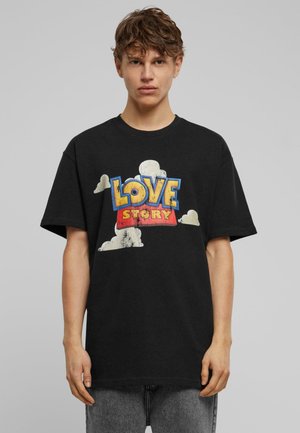 Black cotton t-shirt featuring "LOVE" in yellow and "STORY" in red against a cloudy background, with a relaxed fit and short sleeves.
