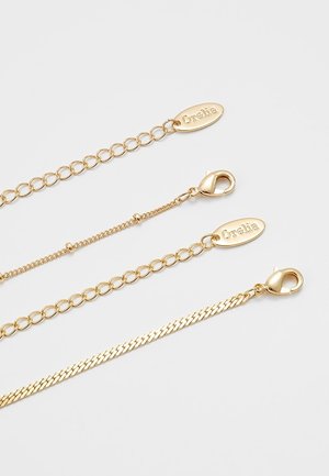 Kaulakoru - gold-coloured