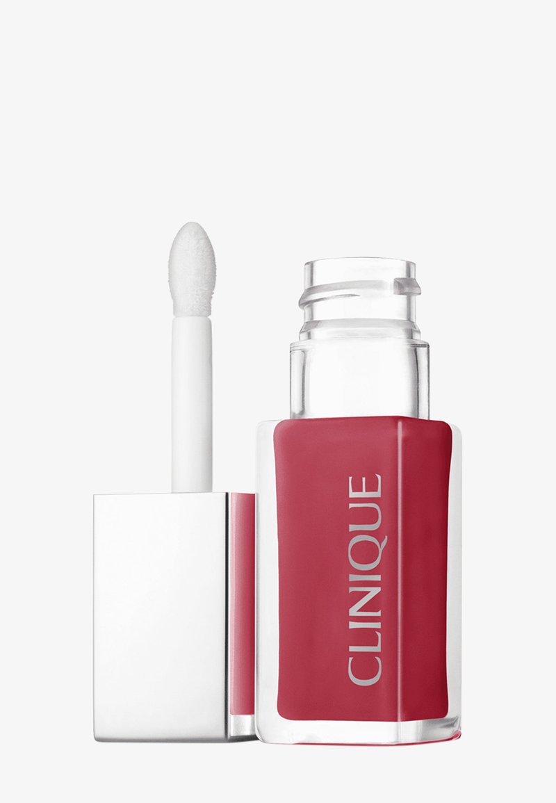 Clinique läppprodukt i en klar glasflaska med en rosa vätska. Har ett silverlock och en vit applicator med en rundad spets.