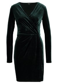 Mørkegrøn fløjlskjole med lange ærmer, v-udskæring og omslagdesign. Har en glat tekstur og diskrete syninger.