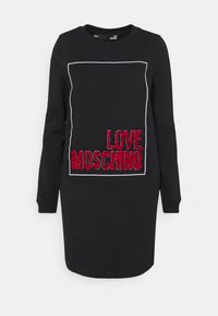 Black long-sleeve sweatshirt dress with white outline, featuring red embroidered text "LOVE MOSCHINO" at the bottom in a bold, playful font.