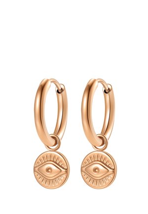 Pair of gold hoop earrings with dangling round charms embossed with an eye design and surrounding rays.