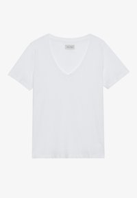 Vit bomullströja med V-ringning och korta ärmar. Mjuk textur, standardpassform, inga mönster eller utsmyckningar. Varumärkesetikett synlig.