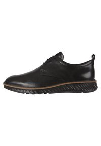 Scarpa in pelle nera con finitura liscia, cuciture a contrasto di colore marrone chiaro, punta arrotondata e suola in gomma nera texturizzata. Design con lacci.