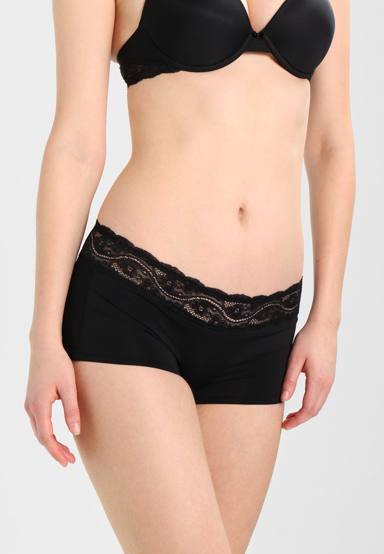Black boyshort underwear with a scalloped lace waistband featuring floral designs. Smooth fabric with a fitted shape.