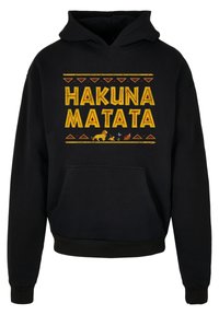 Felpa con cappuccio nera con "HAKUNA MATATA" stampato in giallo e arancione, caratterizzata da grafiche di animali e una tasca frontale.