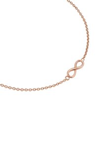 Rózsaarany nyaklánc végtelen szimbólum medállal. Finom lánccal és sima, fényes textúrával rendelkezik, amely minimalista megjelenést kölcsönöz.