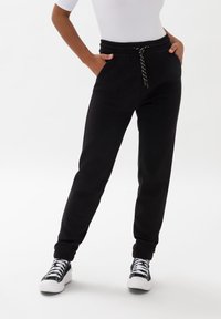 Les Lunes FRAYAA - Træningsbukser - schwarz