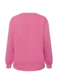 Un sweat-shirt à manches longues, rose vif et uni, avec des poignets côtelés et un col rond, présenté de dos sur un fond blanc.