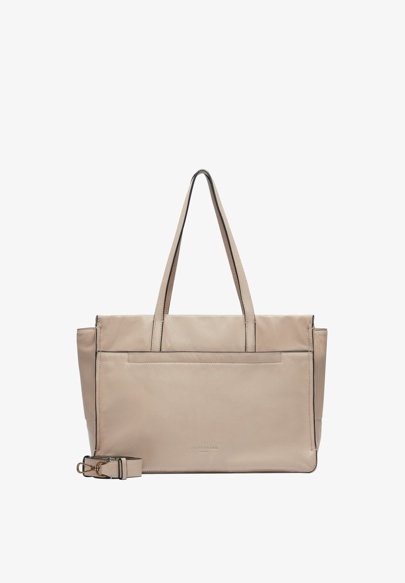 Beżowa skórzana torba na ramię z podwójnymi ramiączkami, prostokątna forma, zapięcie na zamek błyskawiczny na górze oraz zewnętrzna kieszeń wsuwana. Czarna akcentująca przeszywka.