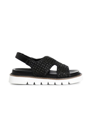 Sandal a fascia nera intrecciata con ritagli, tomaia testurizzata e suola bianca spessa. Presenta una finitura nera lucida e una cinturino regolabile.