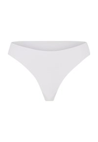 White thong panties with a smooth texture, low-rise design, and minimal coverage. Made from soft fabric, featuring clean lines and no visible seams.