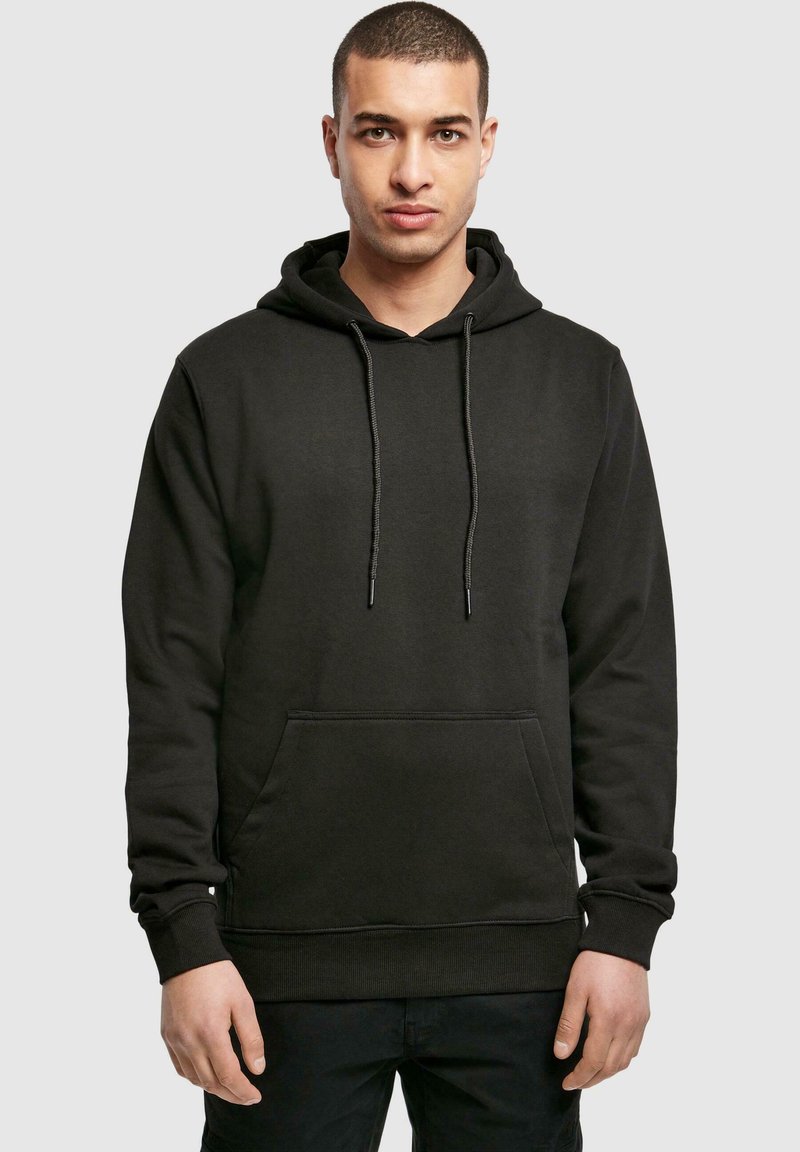 Black hooded sweatshirt with a kangaroo pocket, drawstring, ribbed cuffs, and hem. Made from a soft material, featuring a smooth texture.