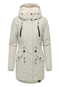 Jasno beżowa ocieplana parka z kapturem, posiadająca puszystą podszewkę, regulowane sznurki, czarne kieszenie na zamek oraz akcenty na napy.