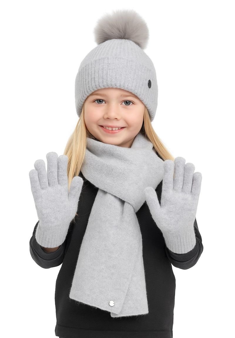Light gray knit beanie with pom-pom, matching gloves, and scarf. Soft texture, ribbed design, and silver button accent on the scarf.